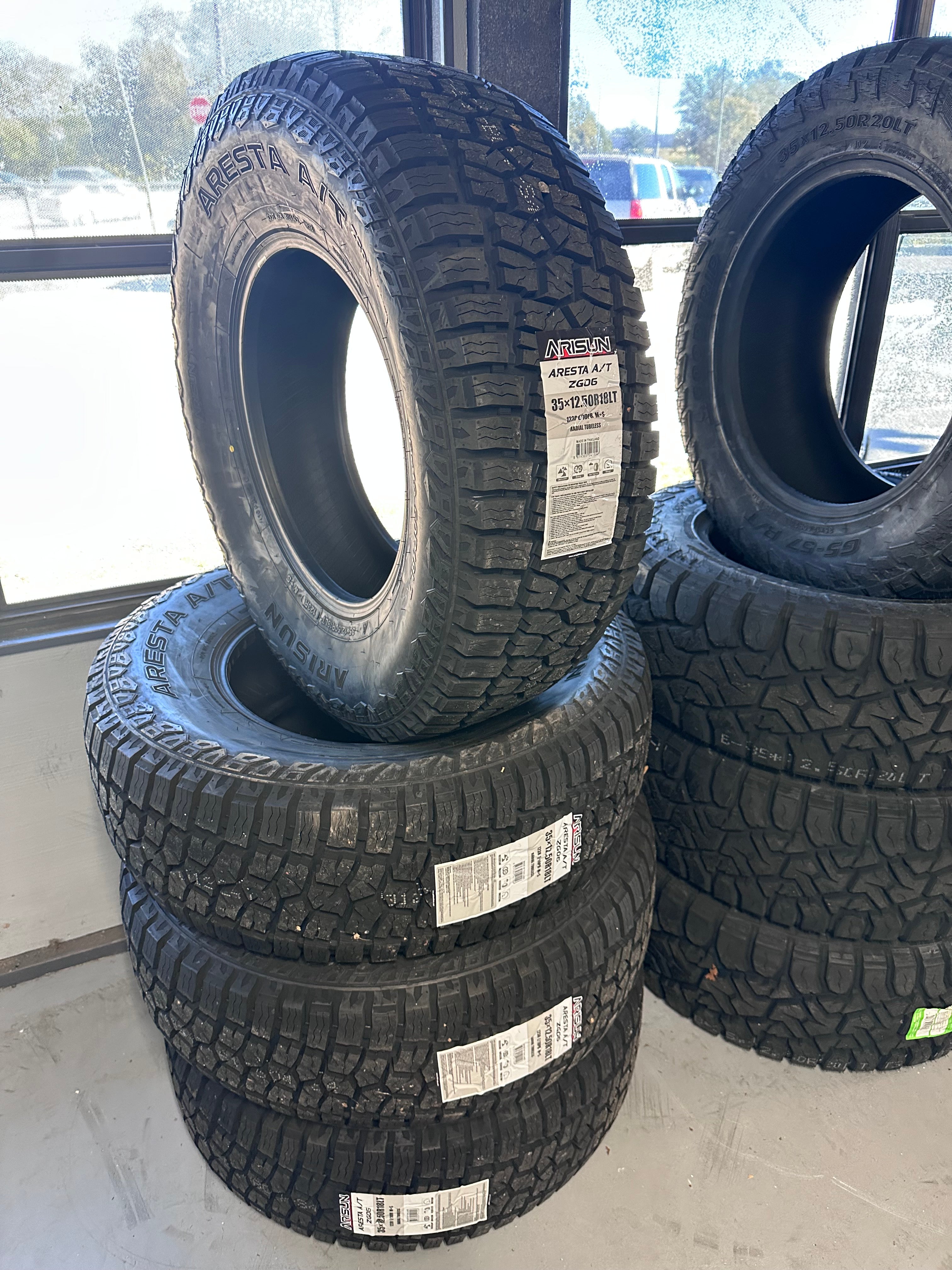 aretan Set of FOUR Arisun Aresta A/T ZG06 35x12.50r18 Including Mount