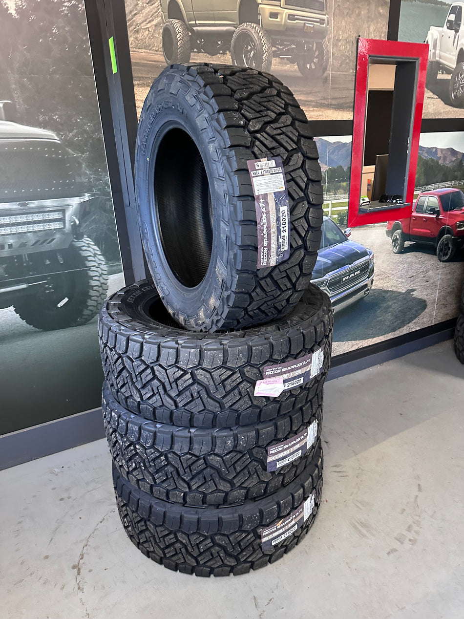 (SET of FOUR) Nitto Recon Grappler AT 12ply 35x12.50r20 with Mount & Balance